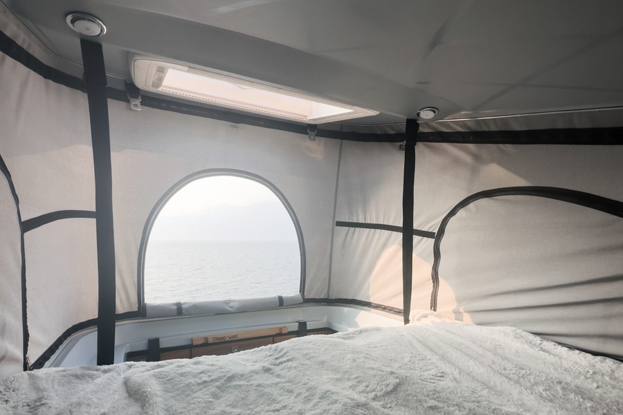 inside view to the front of the popup roof with entrance and window view to the sea