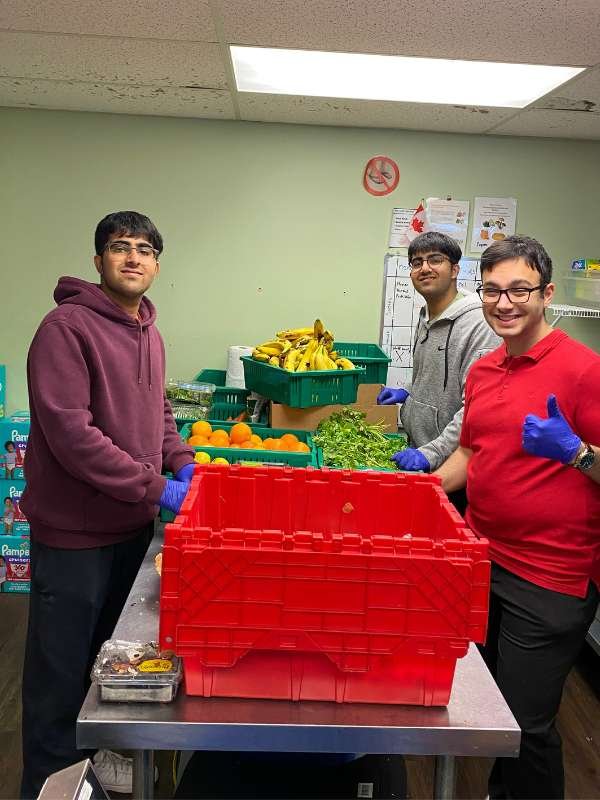 Archway food bank volunteers sorting food.