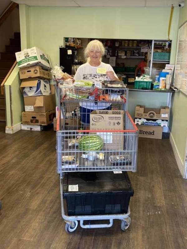 Archway food bank volunteers preparing to serve food.