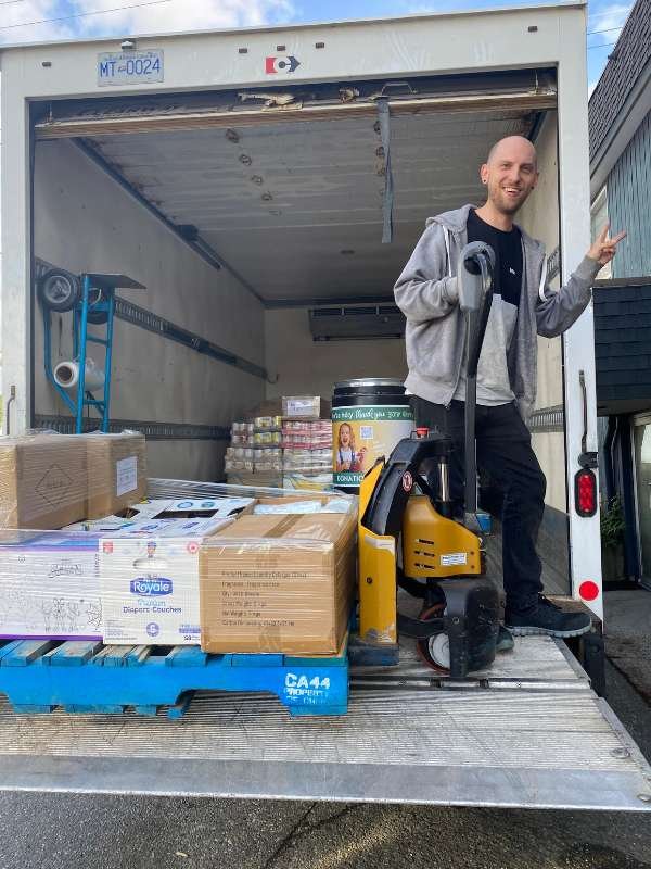 Archway food bank volunteers unloading food.
