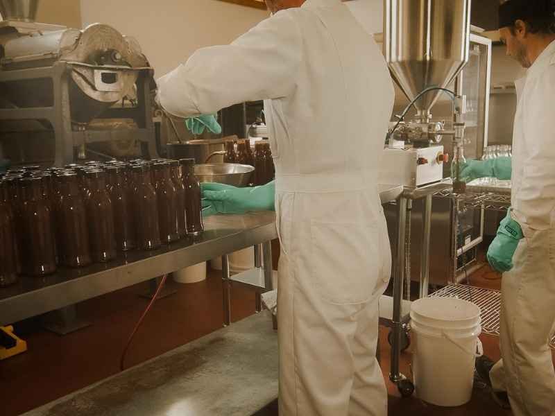 Slow Bottled Sunday staff bottling their sauces.