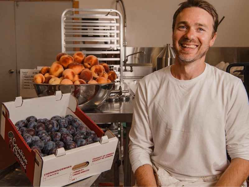 Chef Nate in front of rescued fruit.