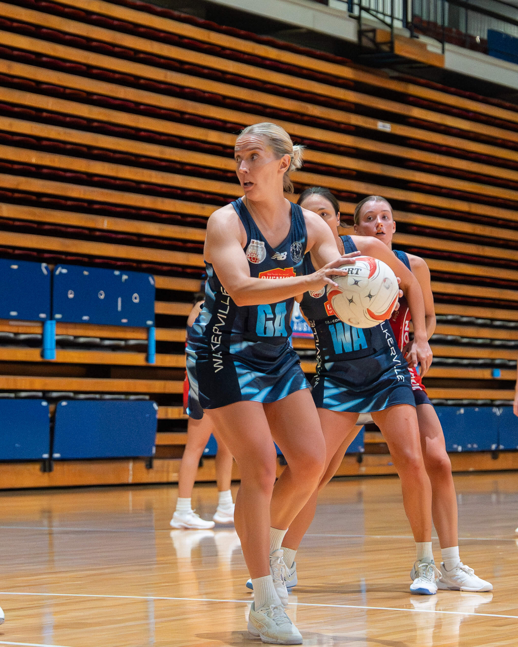 Jess Paradiso drives through the midcourt for the Cats