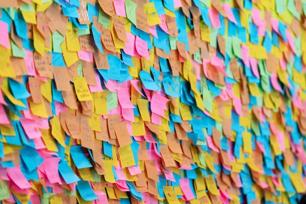Colorful sticky notes cover a large surface.