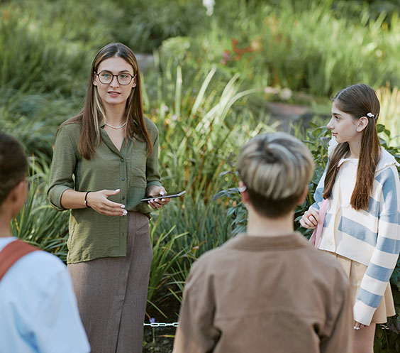 Teacher with students on excursion