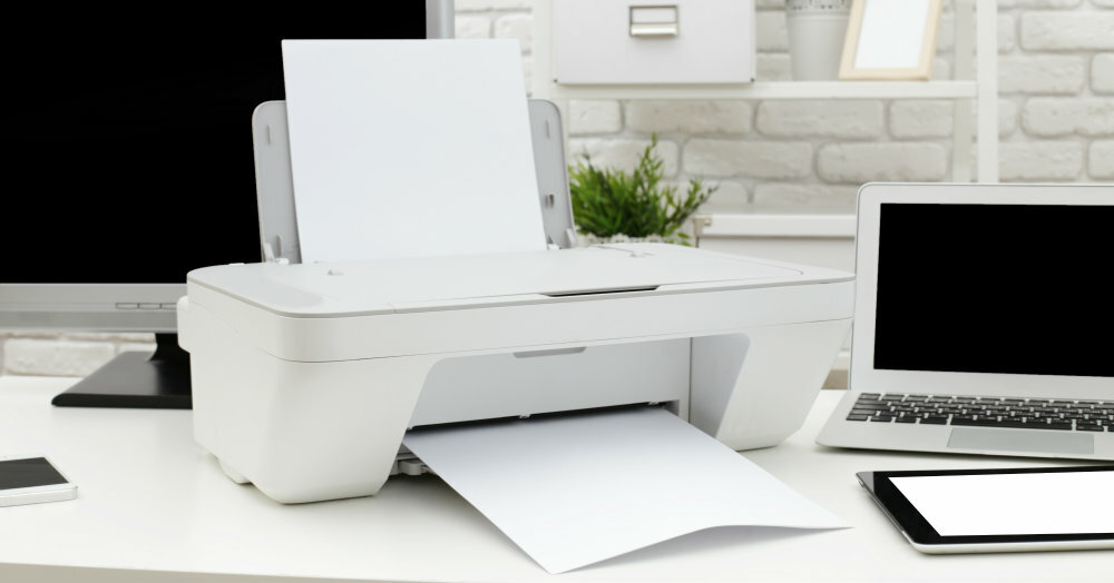 Shining white printer on modern office desk