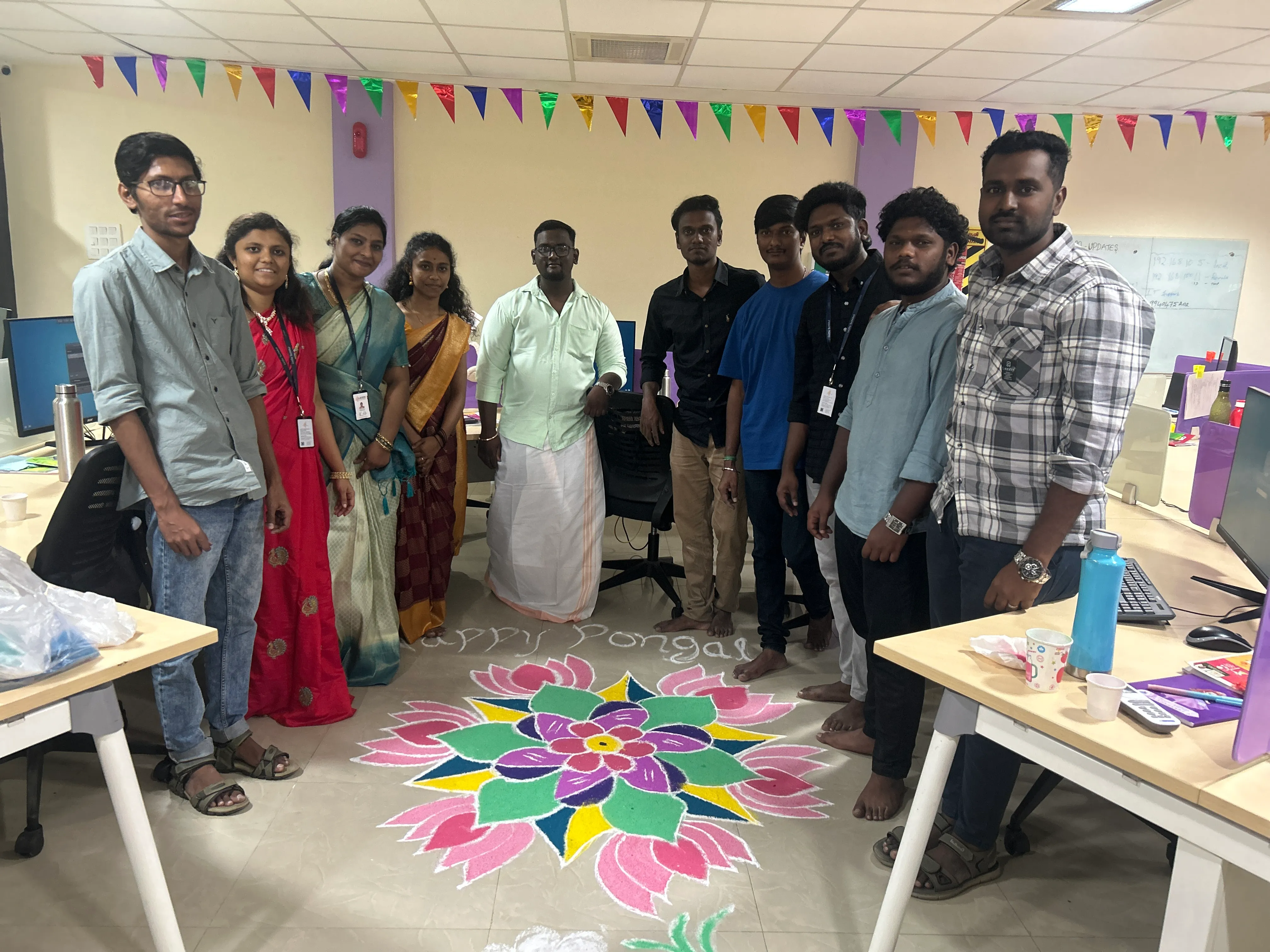 A grayscale wide-angle shot of a clean, modern office hallway and common area.