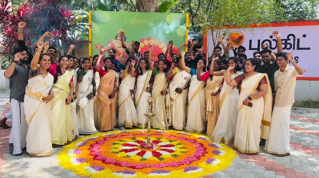 A grayscale image of a group discussion in an office, presented with rounded corners.