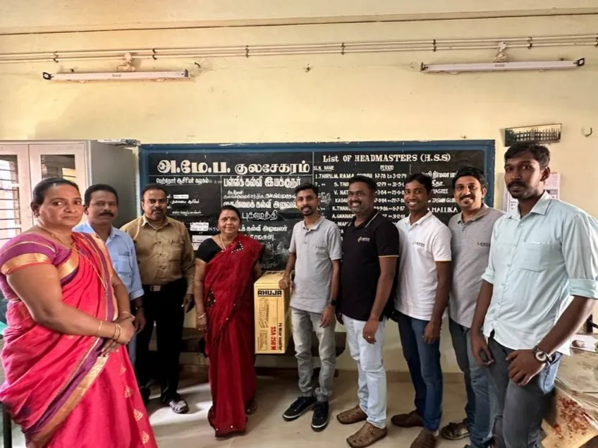 A grayscale photograph of an apple on a stack of books, representing educational initiatives.