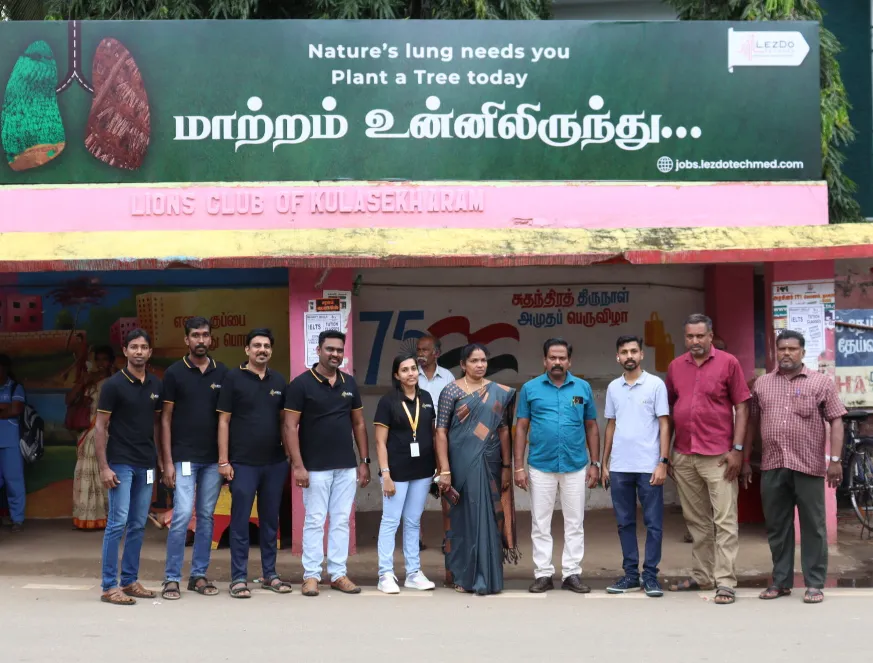 A grayscale photograph of a teacher and students in a classroom setting.