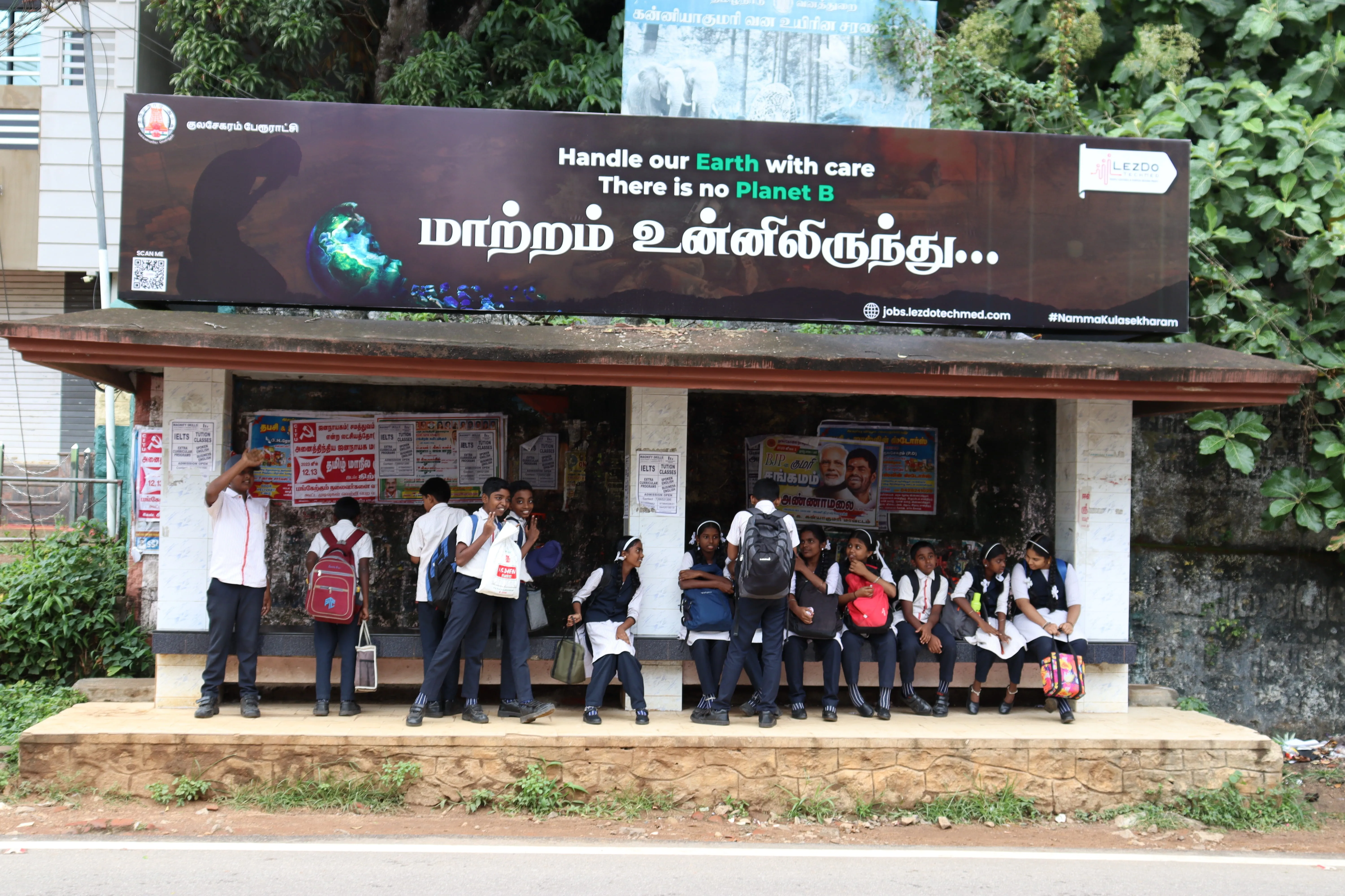 A grayscale photograph of volunteers loading boxes onto a truck.