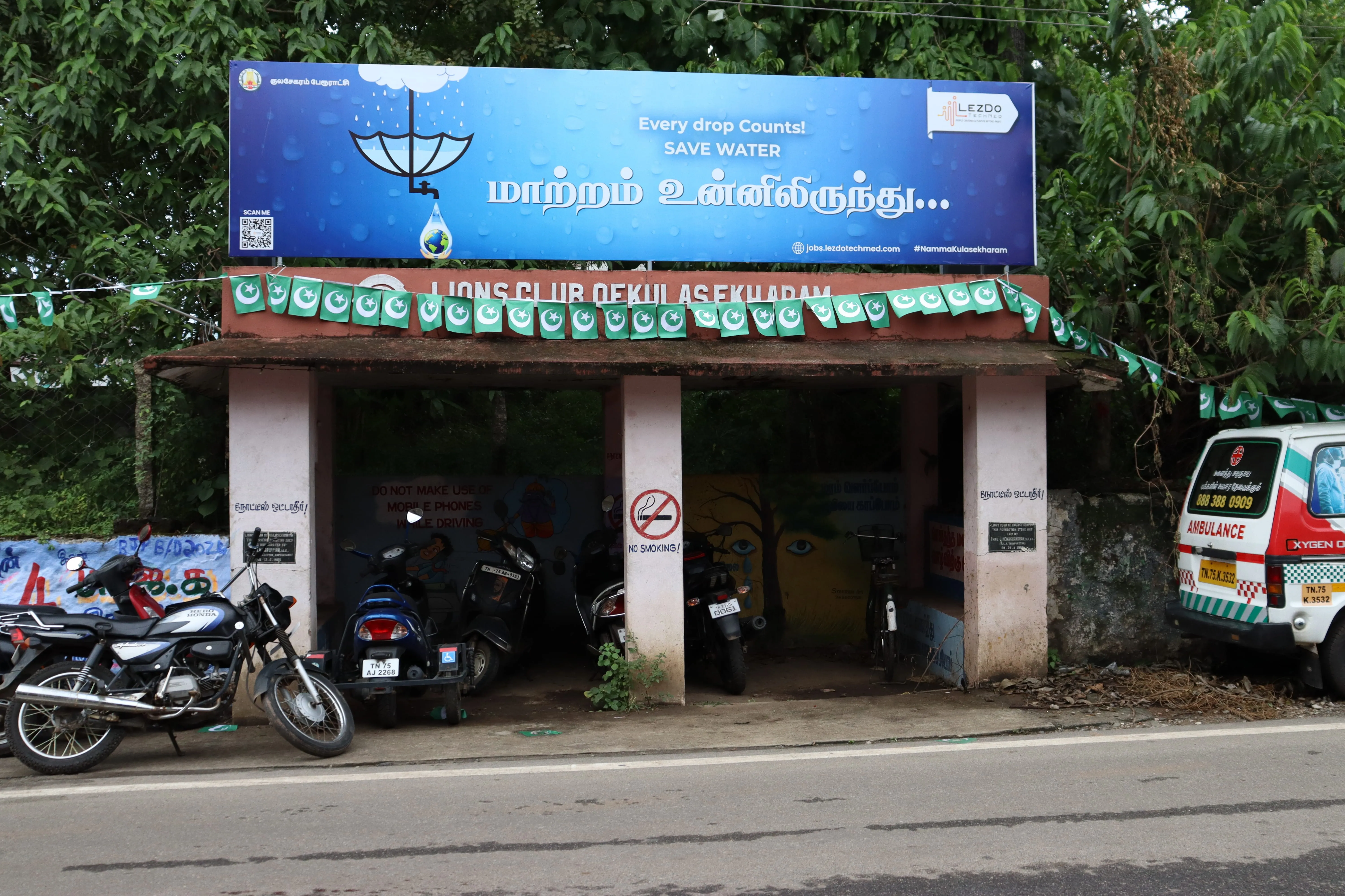 A grayscale photograph of a person wearing a 'VOLUNTEER' shirt from behind.