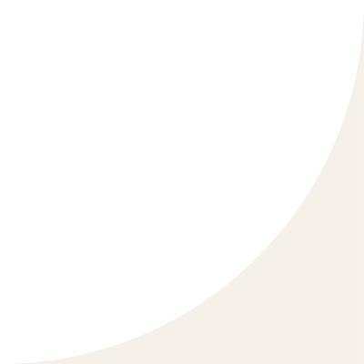 Black circular shape with a curved cutout on the right side against a light gray background.