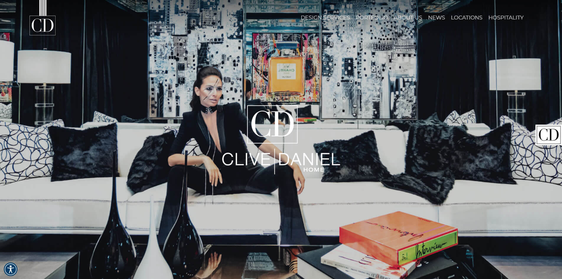 Clive Daniel Home website homepage, with a model seated in a richly patterned dark living room