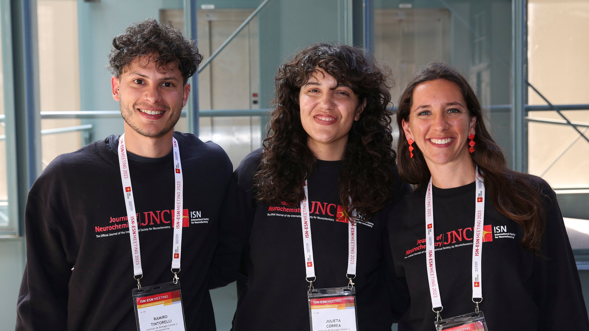 Young researchers wearing Journal of Neurochemistry (JNC) jumpers at an ISN event.