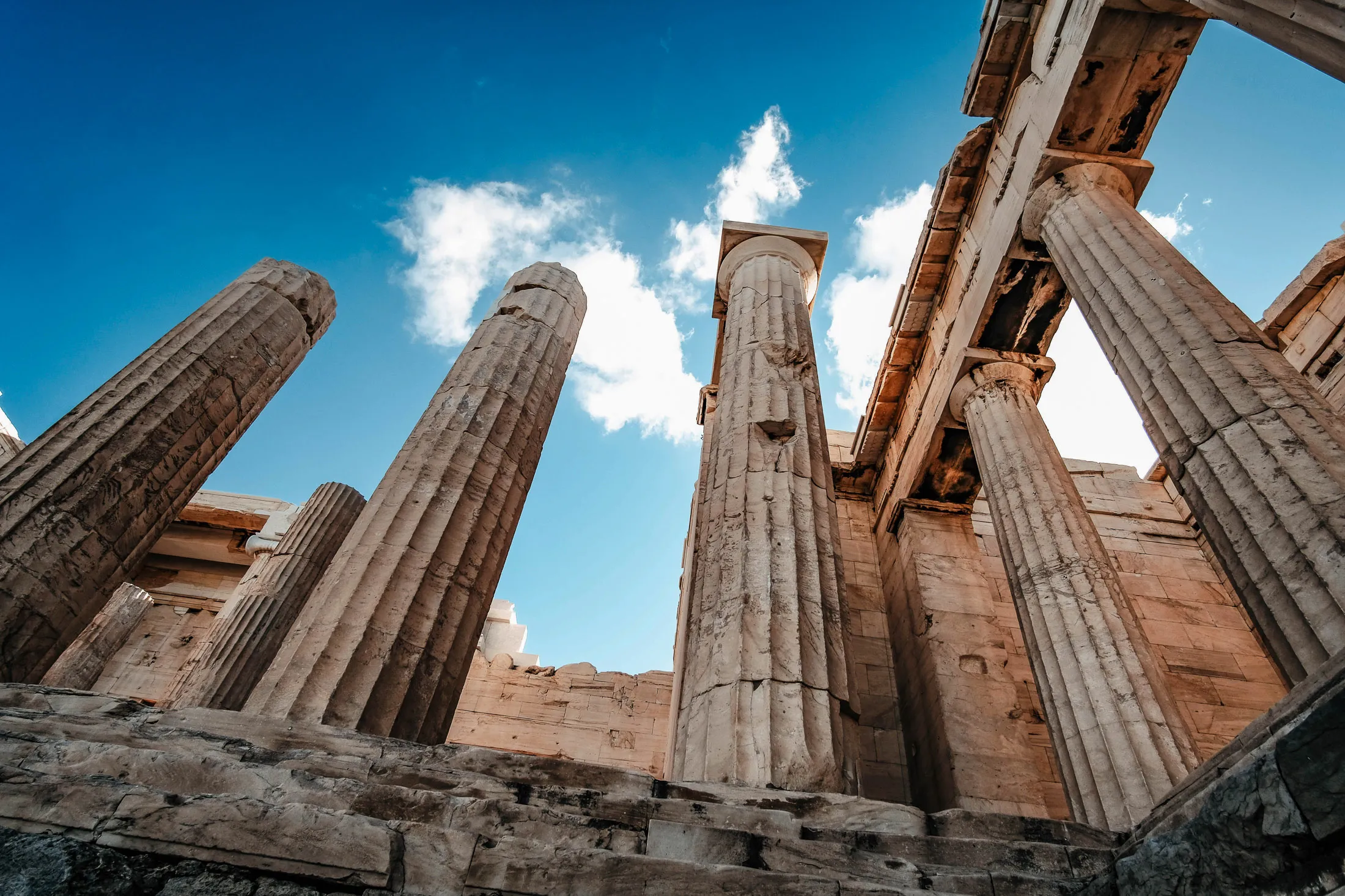 Ancient Greek columns in Athens, showcasing the city’s historic architecture and cultural experiences.