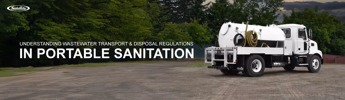 A Satellite Industries vacuum truck used for portable sanitation wastewater transport parked near a disposal site, representing regulated wastewater handling and environmental compliance in the sanitation industry.