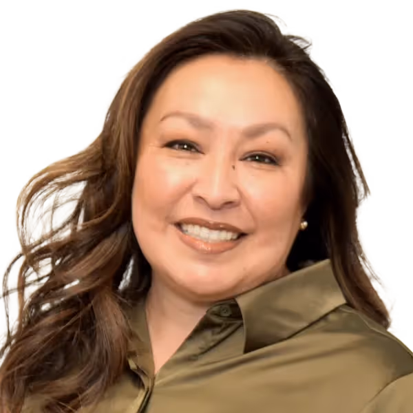 Portrait of a woman with long brown hair wearing an olive green collared shirt