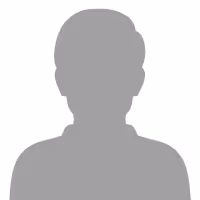 Silhouette of a person with short hair, wearing a collared shirt.