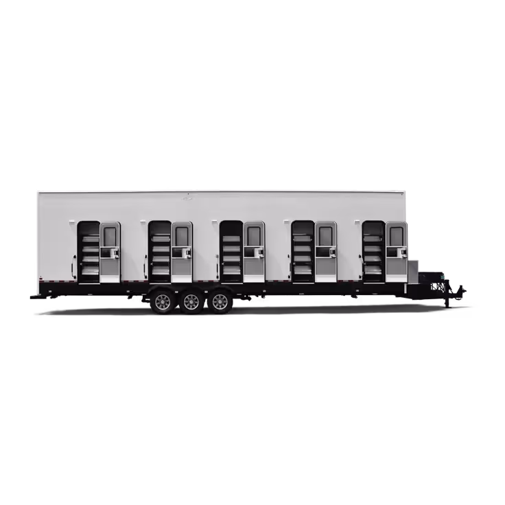 Long white trailer with five open doors revealing steps inside, mounted on triple-axle wheels.