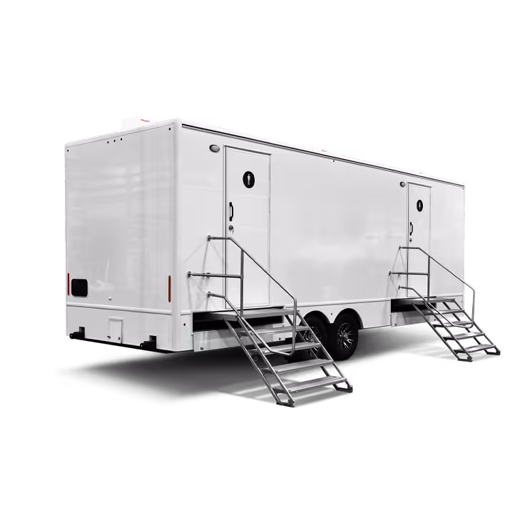 White mobile trailer with two doors and metal staircases on wheels isolated on white.