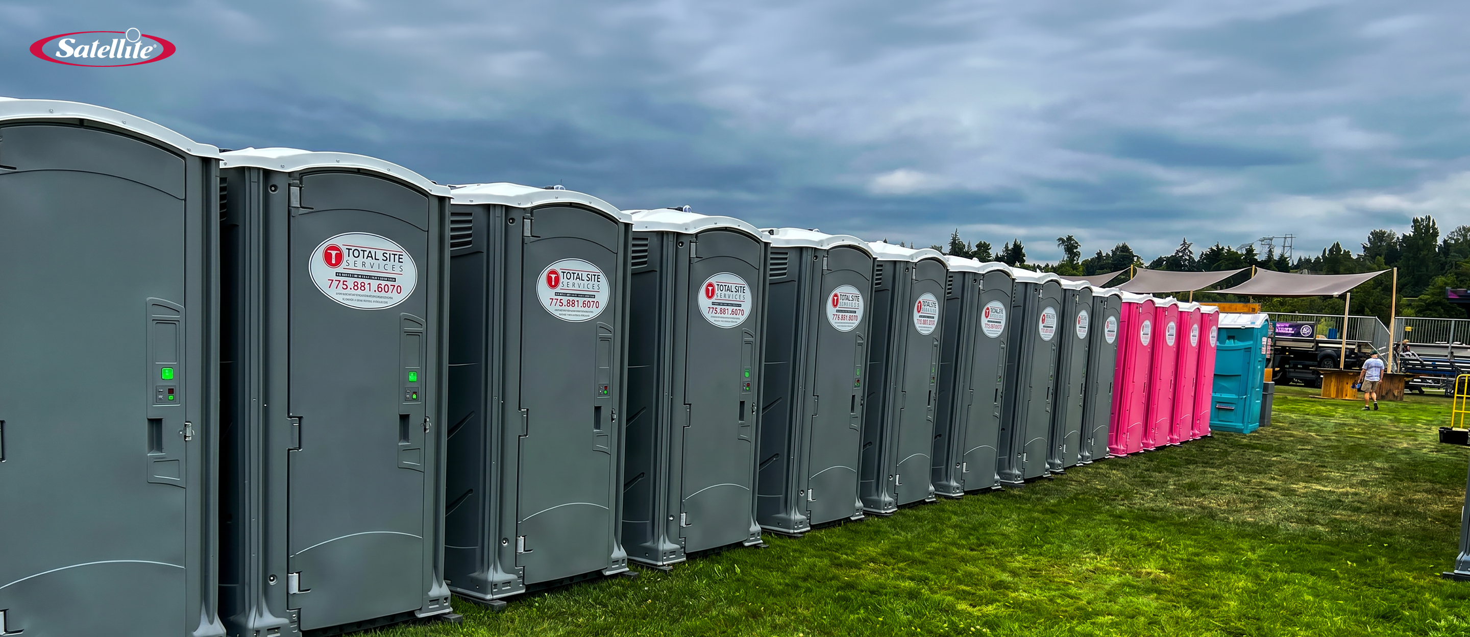 Portable restroom units from Total Site Services lined up at an outdoor event site, showcasing clean portable sanitation solutions, construction site restroom rentals, and reliable service operations in the Canadian portable sanitation industry.