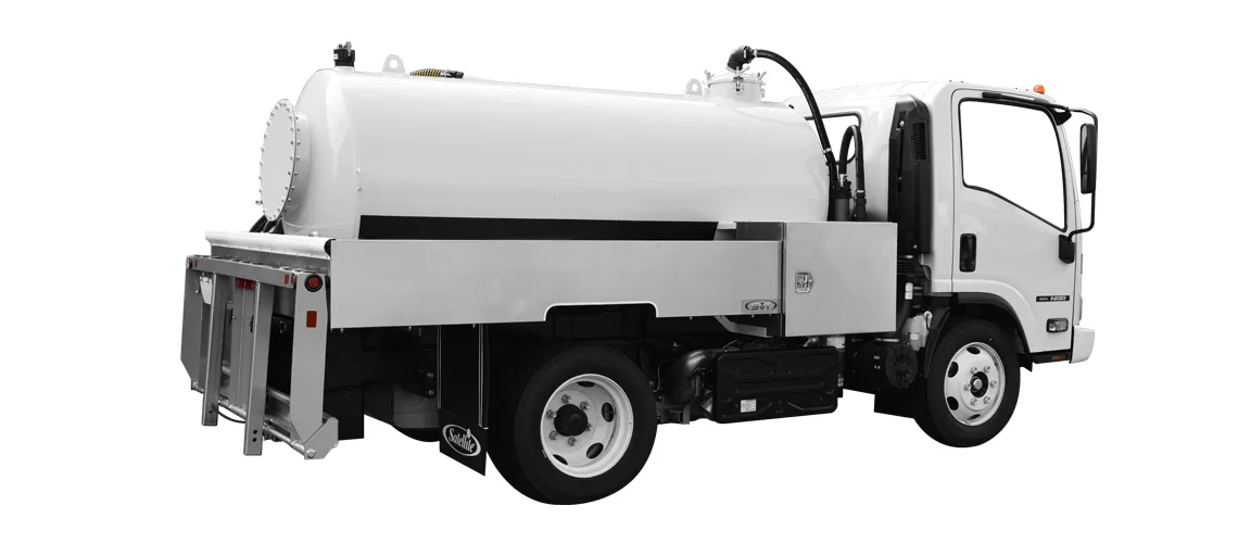 White industrial vacuum truck with large cylindrical tank and cab, shown from the side.