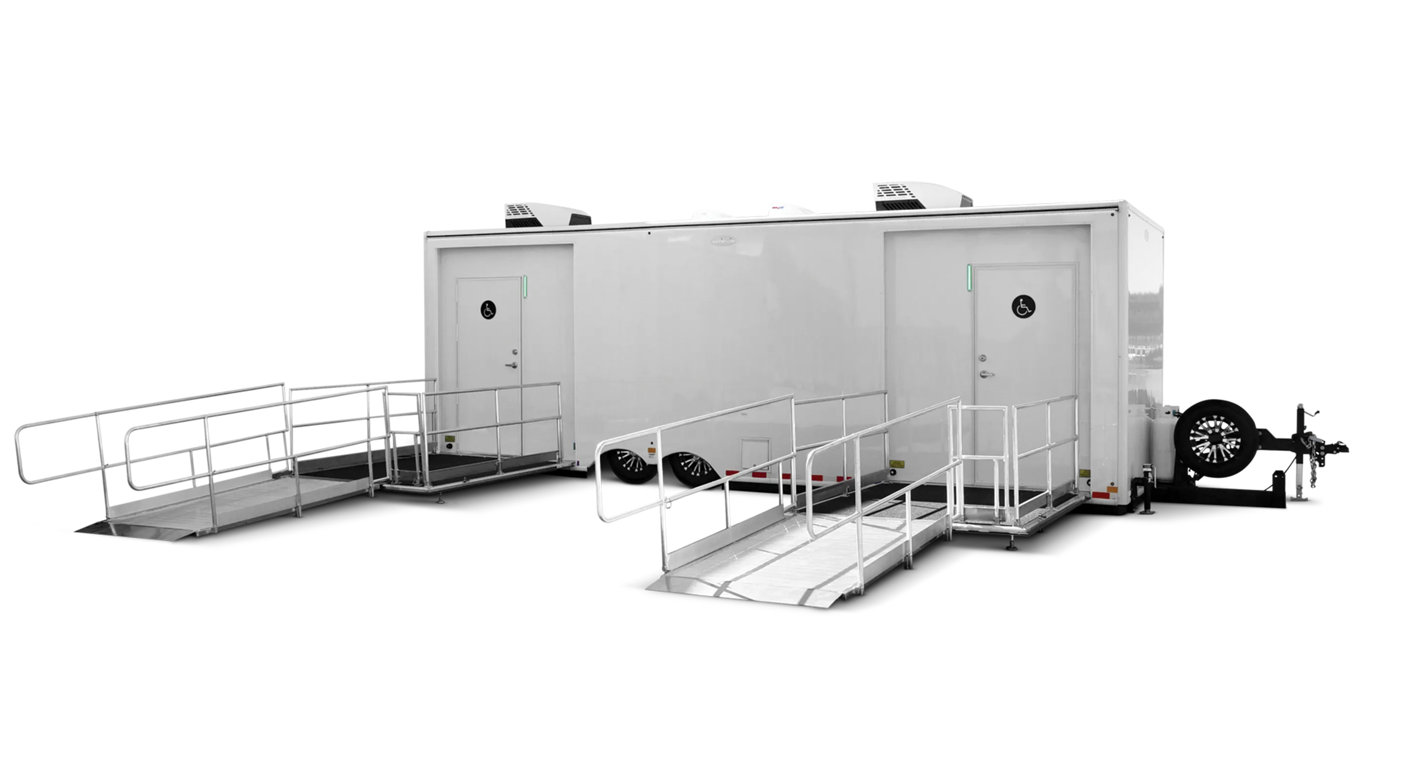 ADA-compliant 8x26' two-door, two-station restroom trailer with ramps and a sleek white exterior.