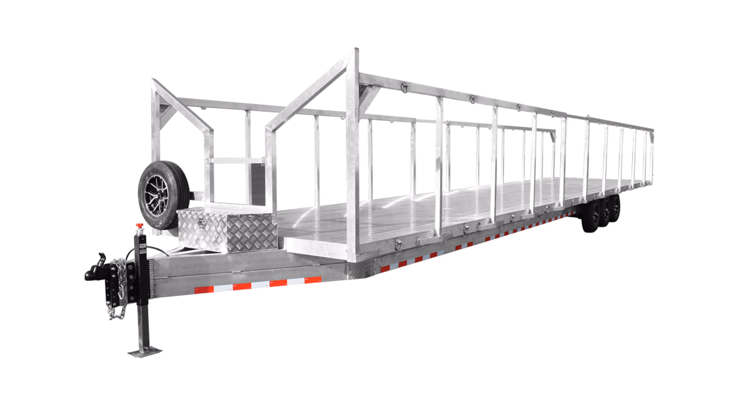 A long flatbed trailer with a metal frame, open sides, and two axles for hauling cargo.
