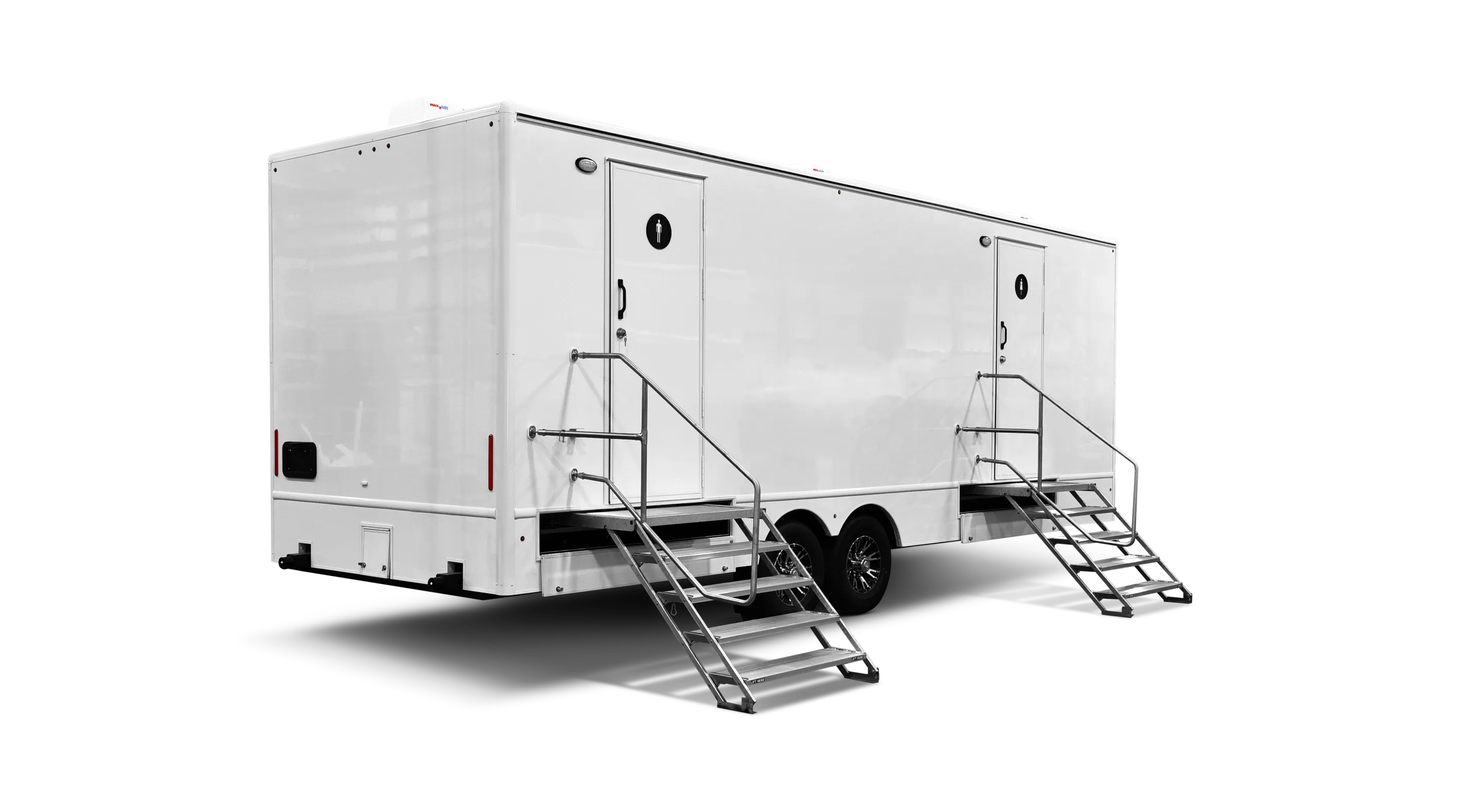 A large white trailer with two sets of stairs, featuring doors on both sides.
