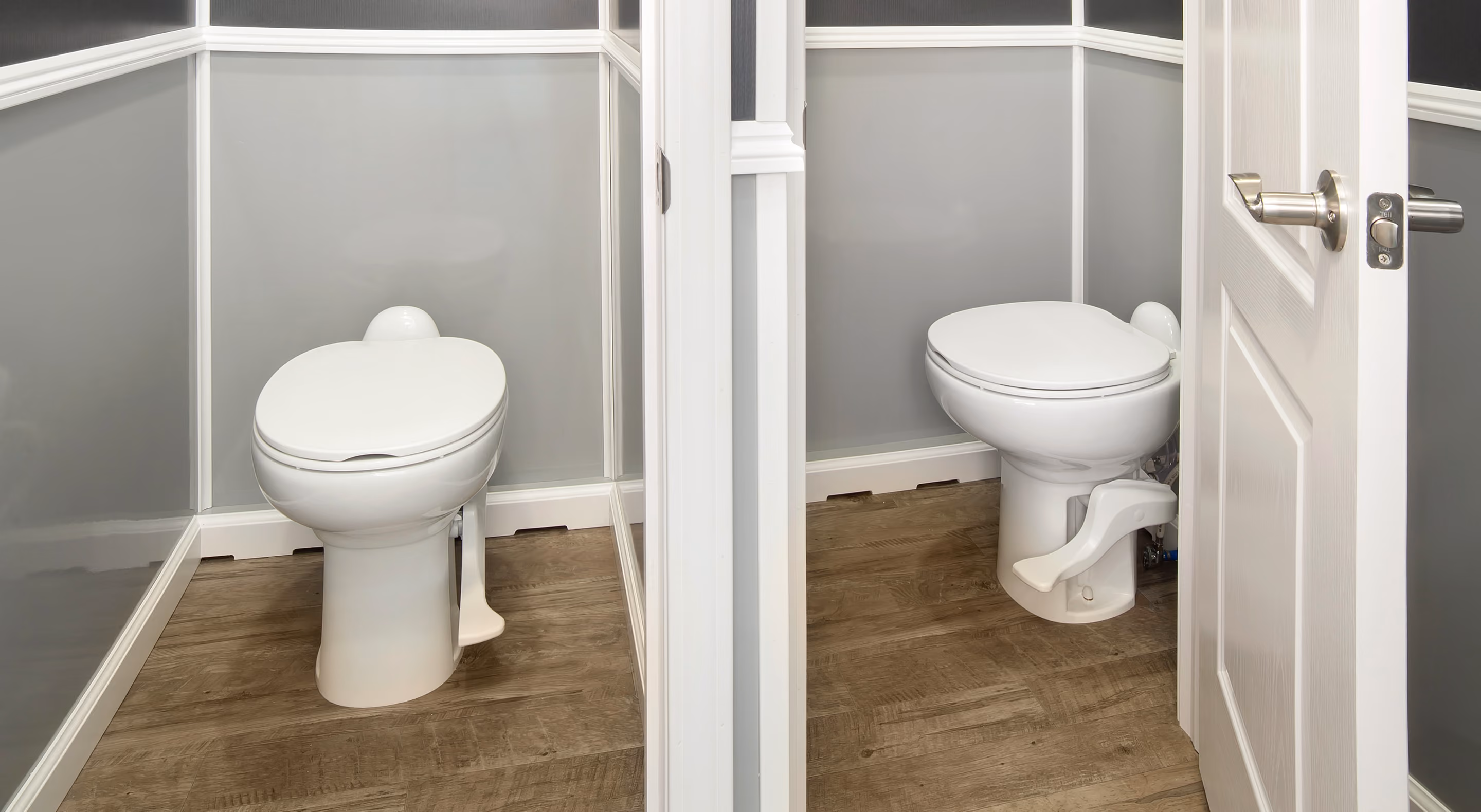 Clean white toilet with foot pedal flush in a small, paneled bathroom with wood-look flooring.