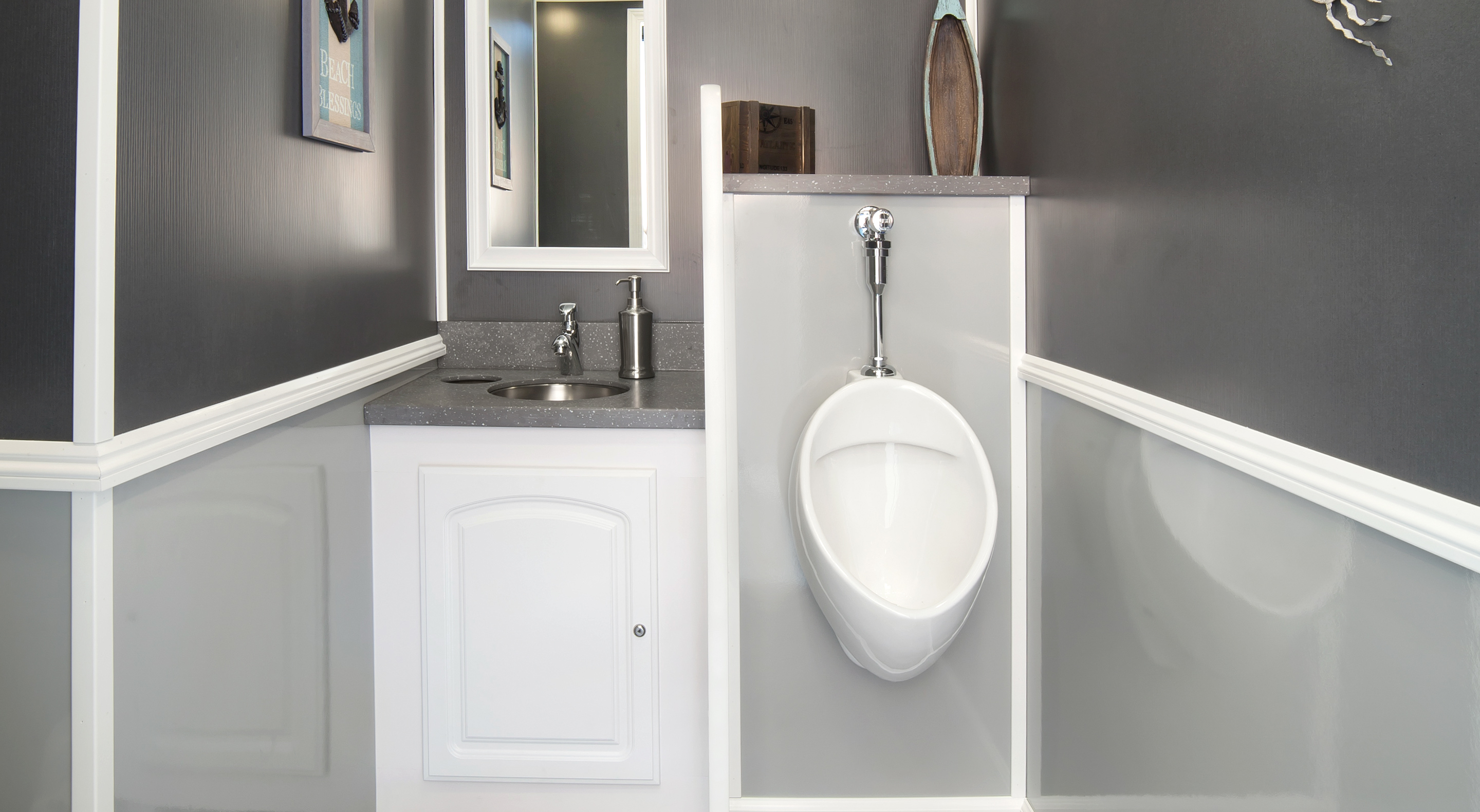 Small bathroom with a gray and white color scheme, featuring a sink and wall-mounted urinal.