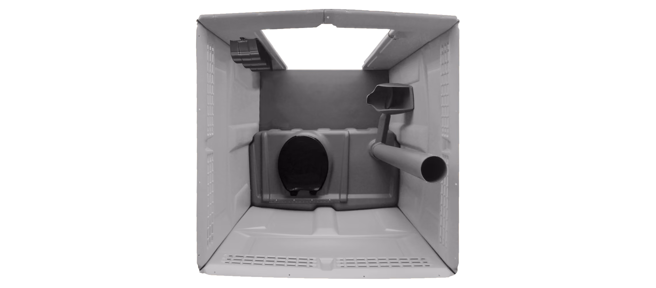 Interior view of a portable plastic outdoor toilet with toilet seat and waste pipe.