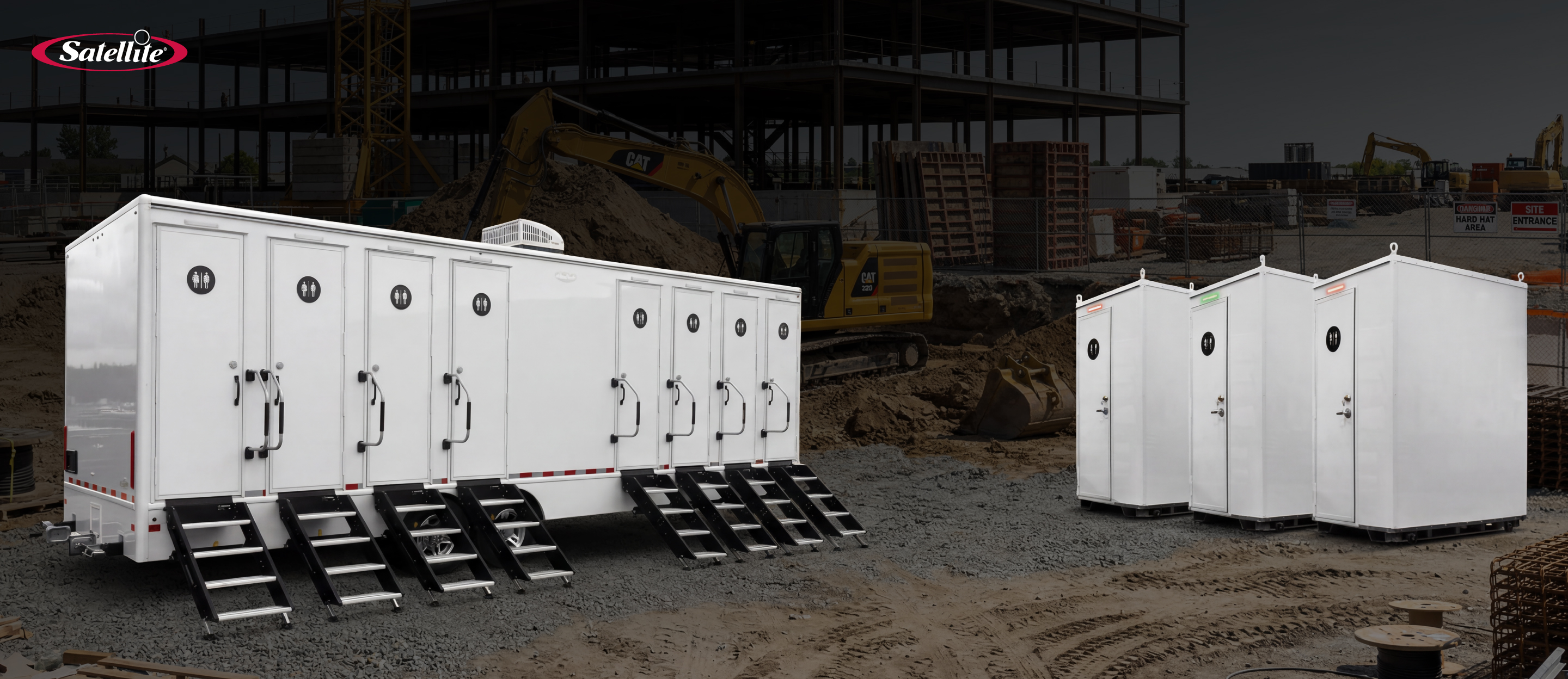 Satellite Industries portable restroom trailers and standalone brick toilet portable restroom units deployed on a large data center construction site, providing scalable sanitation solutions for construction workers. The image highlights portable sanitation equipment for data center construction, including restroom trailers, portable toilets, workforce support infrastructure, and jobsite sanitation solutions that improve productivity, compliance, and worker satisfaction.