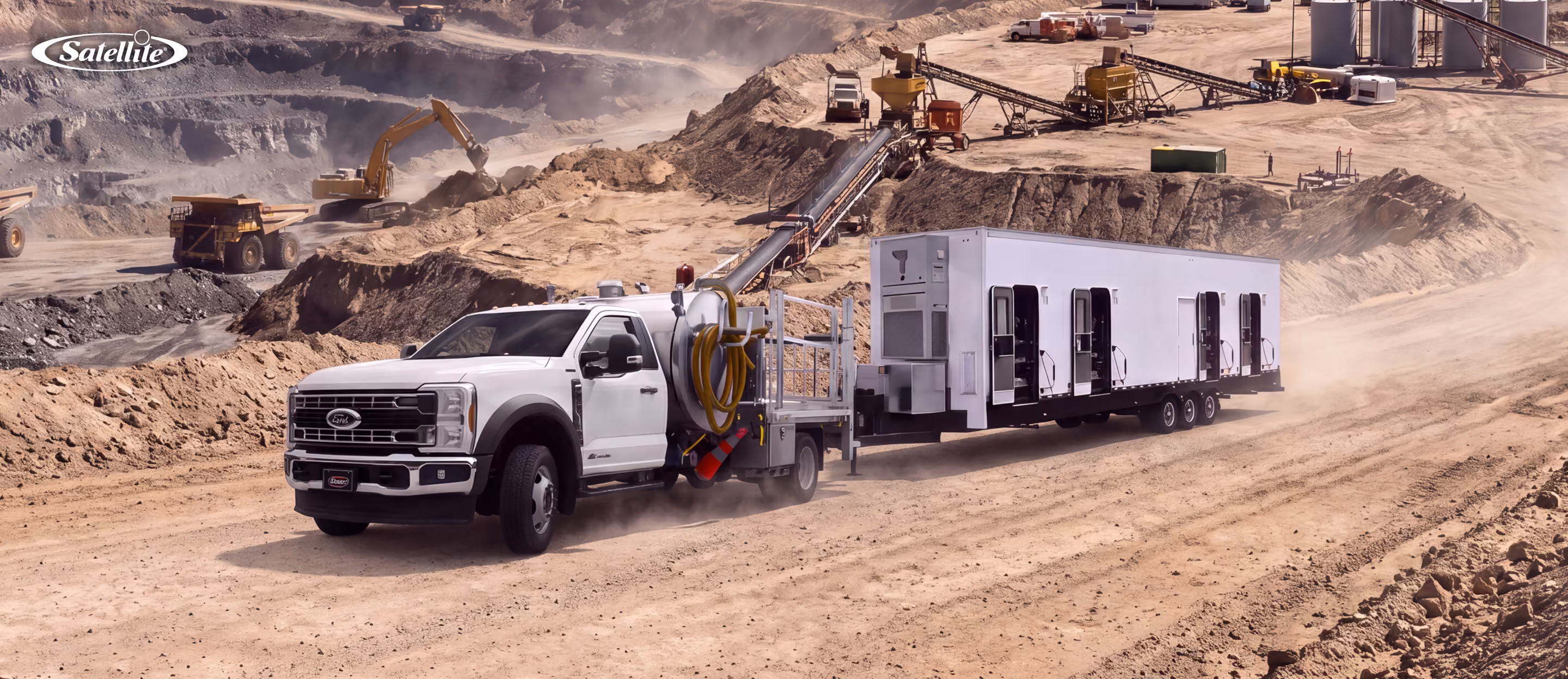 Portable sanitation solutions at a remote mining worksite, featuring a vacuum service truck and mobile restroom trailer supporting worker hygiene, waste management, and sanitation needs for mining, oil and gas, pipeline, and remote industrial operations.