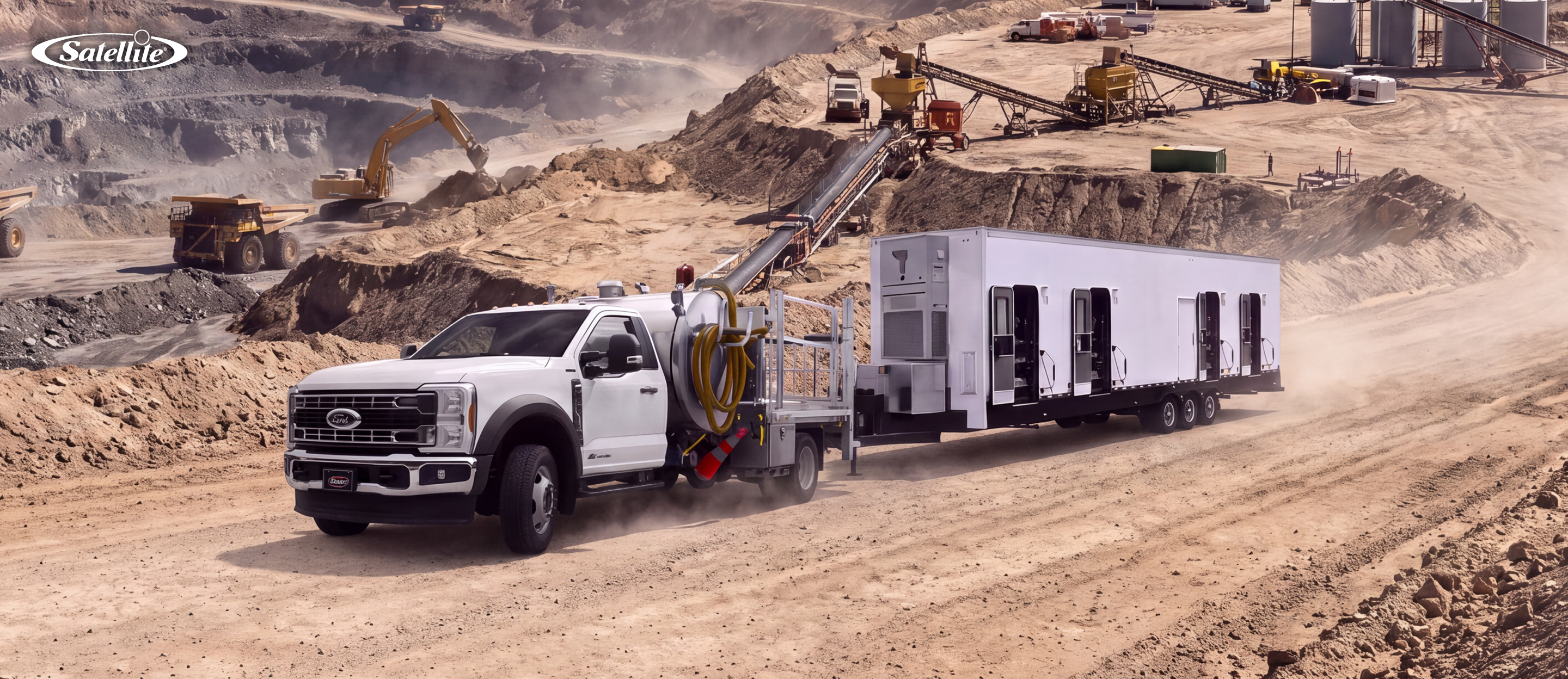 Portable sanitation solutions at a remote mining worksite, featuring a vacuum service truck and mobile restroom trailer supporting worker hygiene, waste management, and sanitation needs for mining, oil and gas, pipeline, and remote industrial operations.