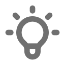 Gray pixelated icon of a light bulb with a square center and rectangular rays.