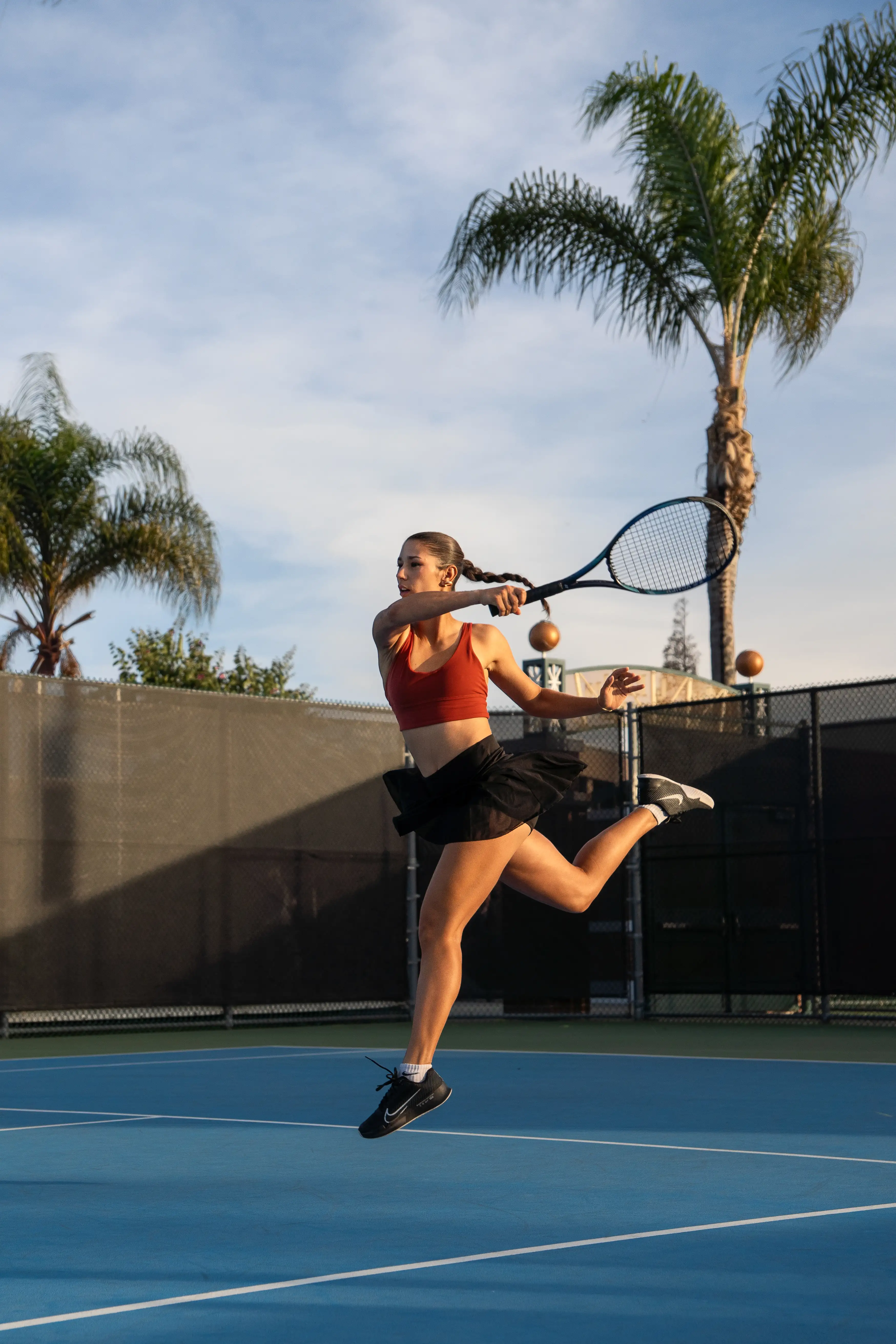 A girl playing tennis.