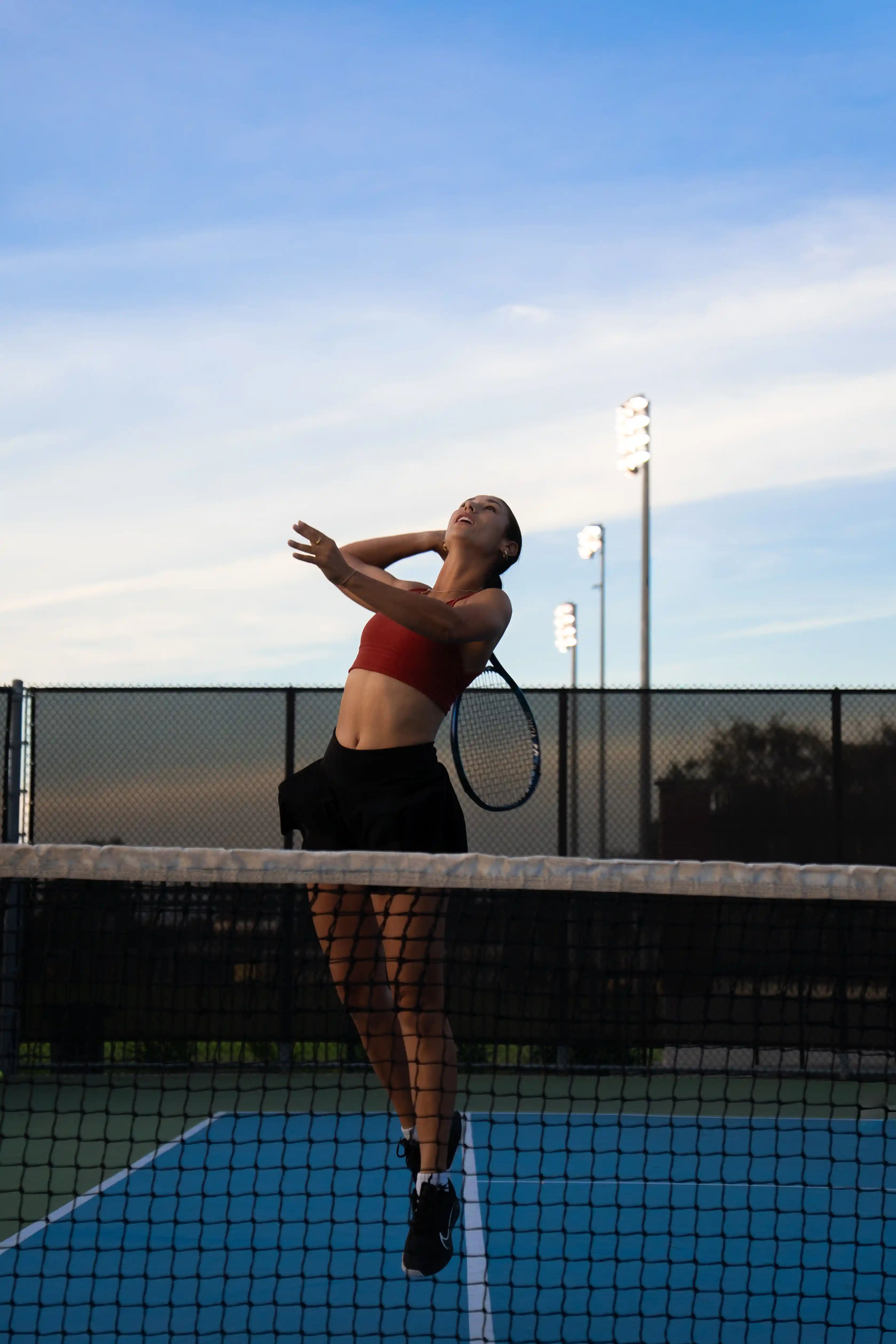 A girl playing tennis.