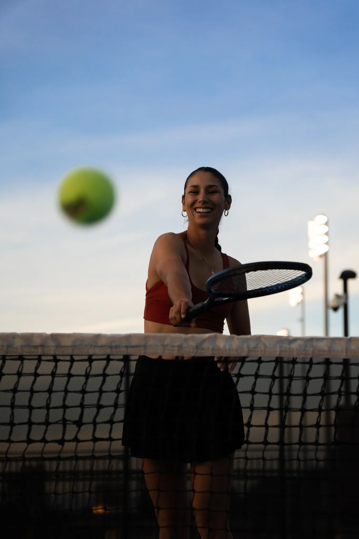 A girl playing tennis.