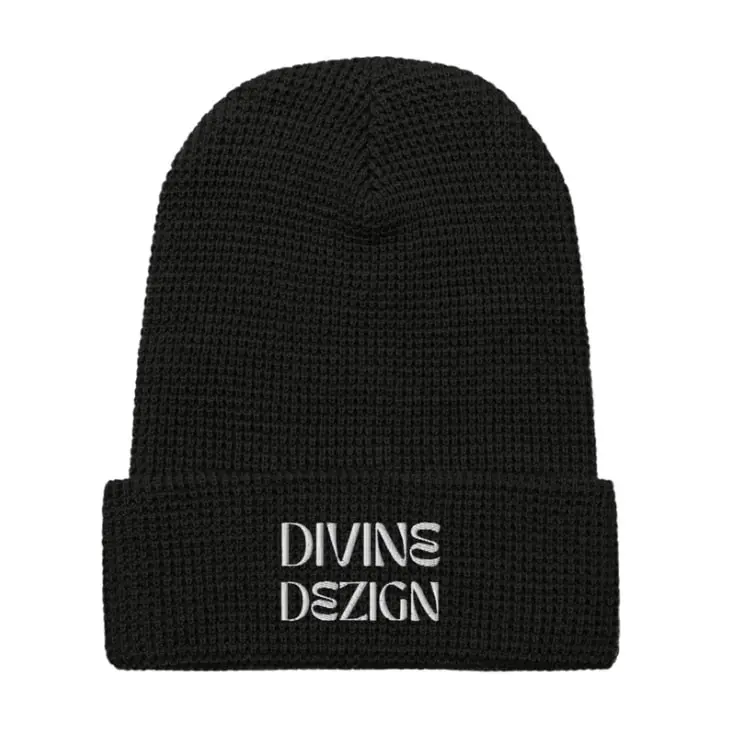 Divine Dezign black beanie with white text.