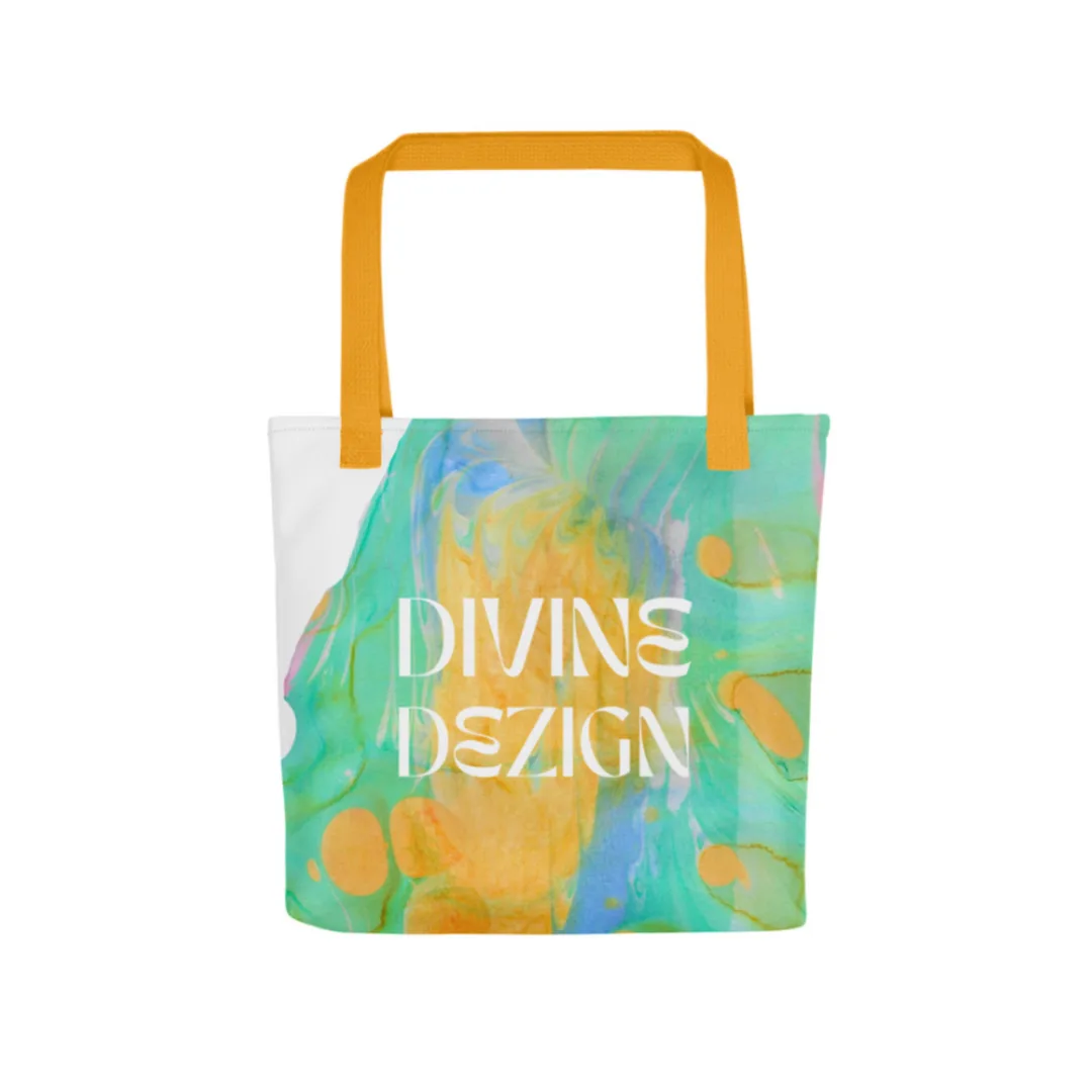 Divine Dezign tote bag with blue and yellow marble print and a orange strap.