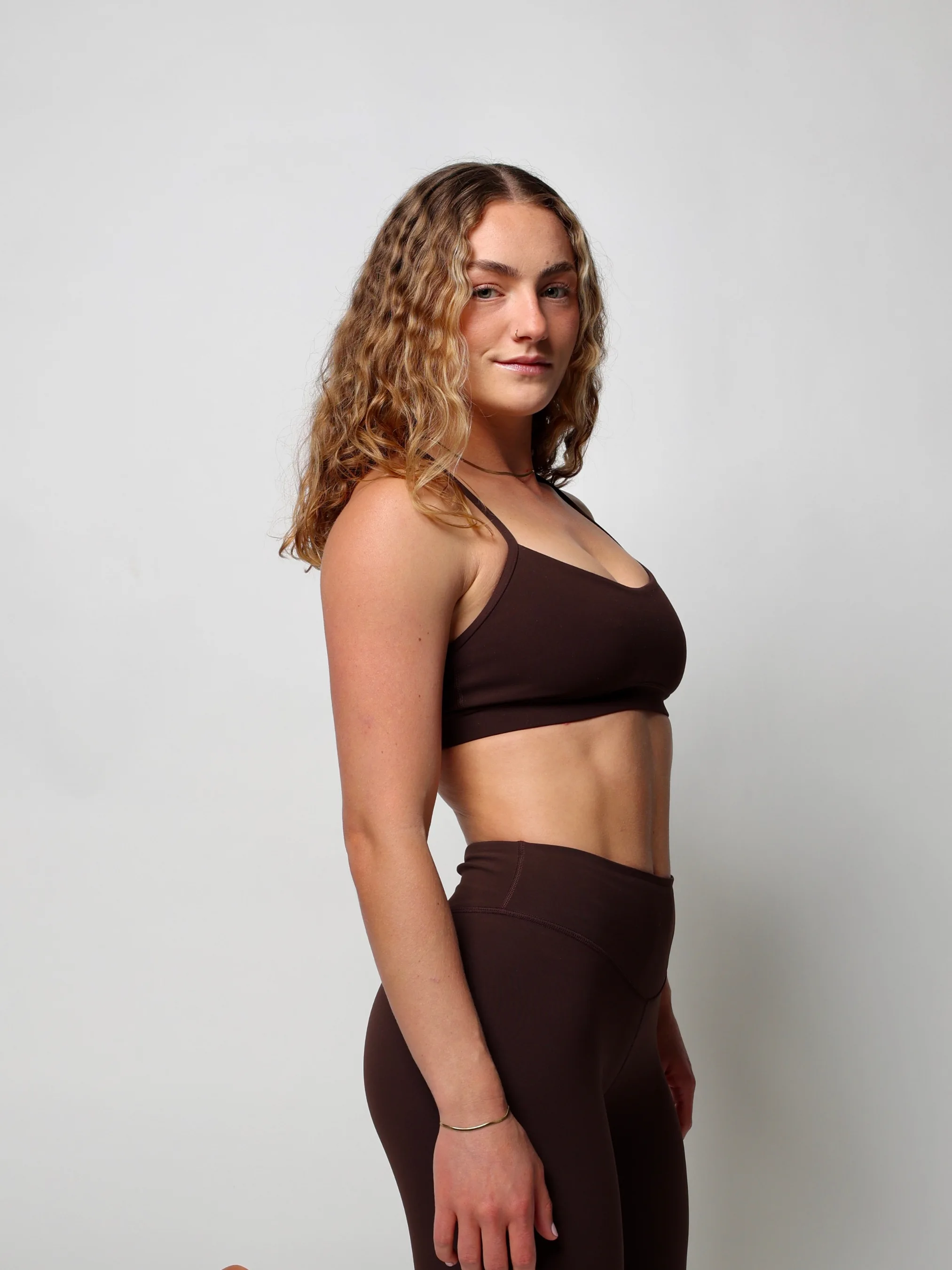 Woman in a a matching Lululemon java workout set.