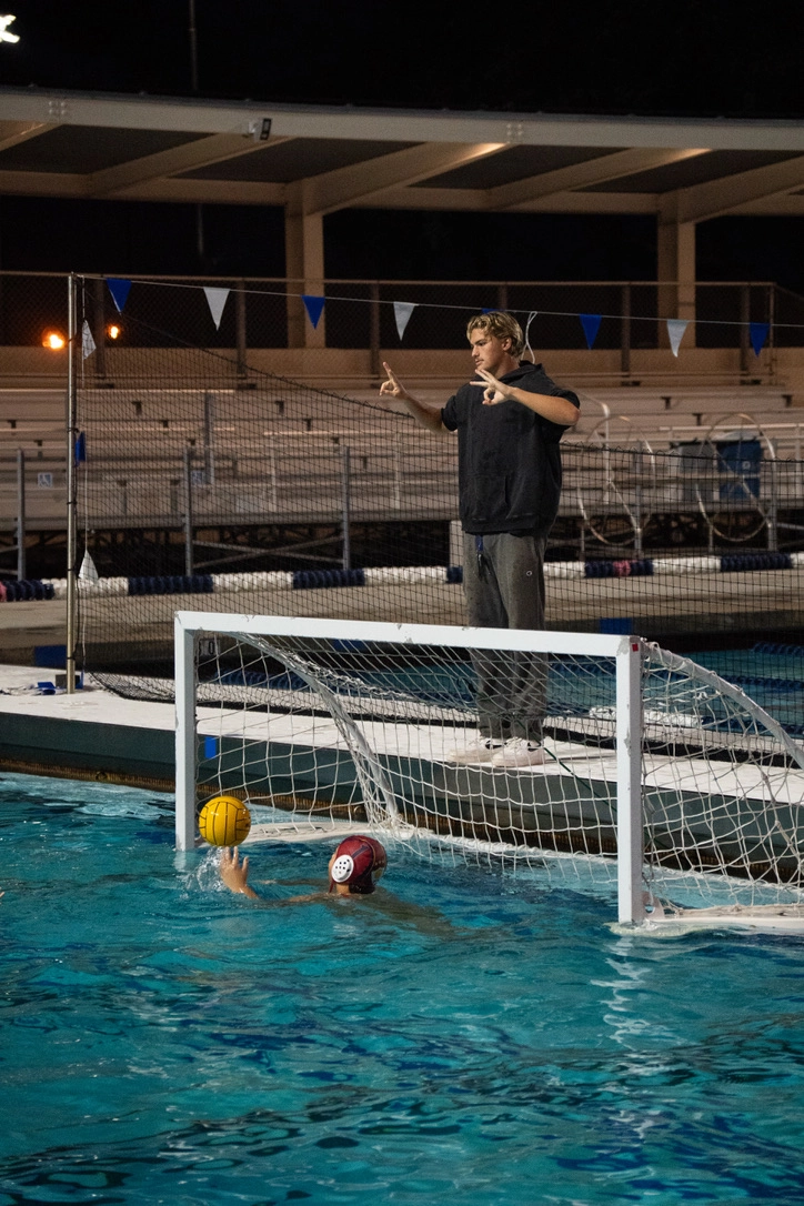 Ovac coach, mentoring children in the pool.