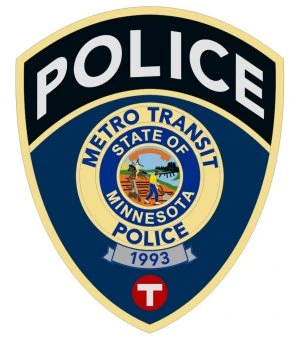 Metro Transit Police badge with Minnesota state seal and year 1993 in blue and gold shield.