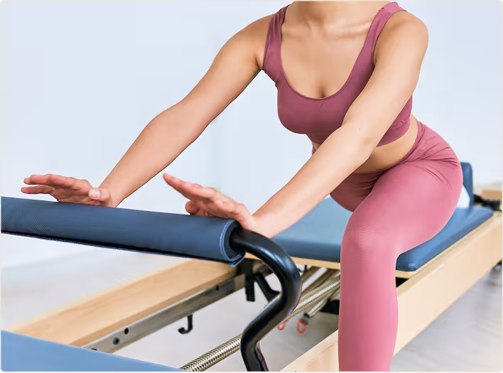 Woman doing pilates in a gym