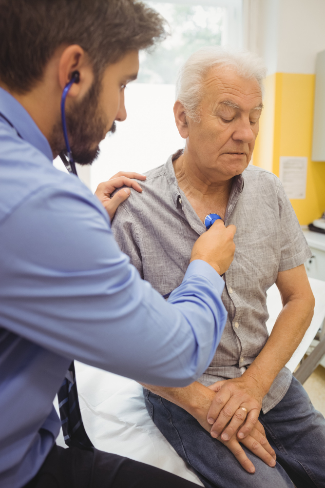 Physician checking a patient's blood pressure during a hypertension visit in Dallas, TX