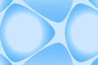Abstract blue shapes with soft gradients forming a symmetrical pattern on a light blue background.