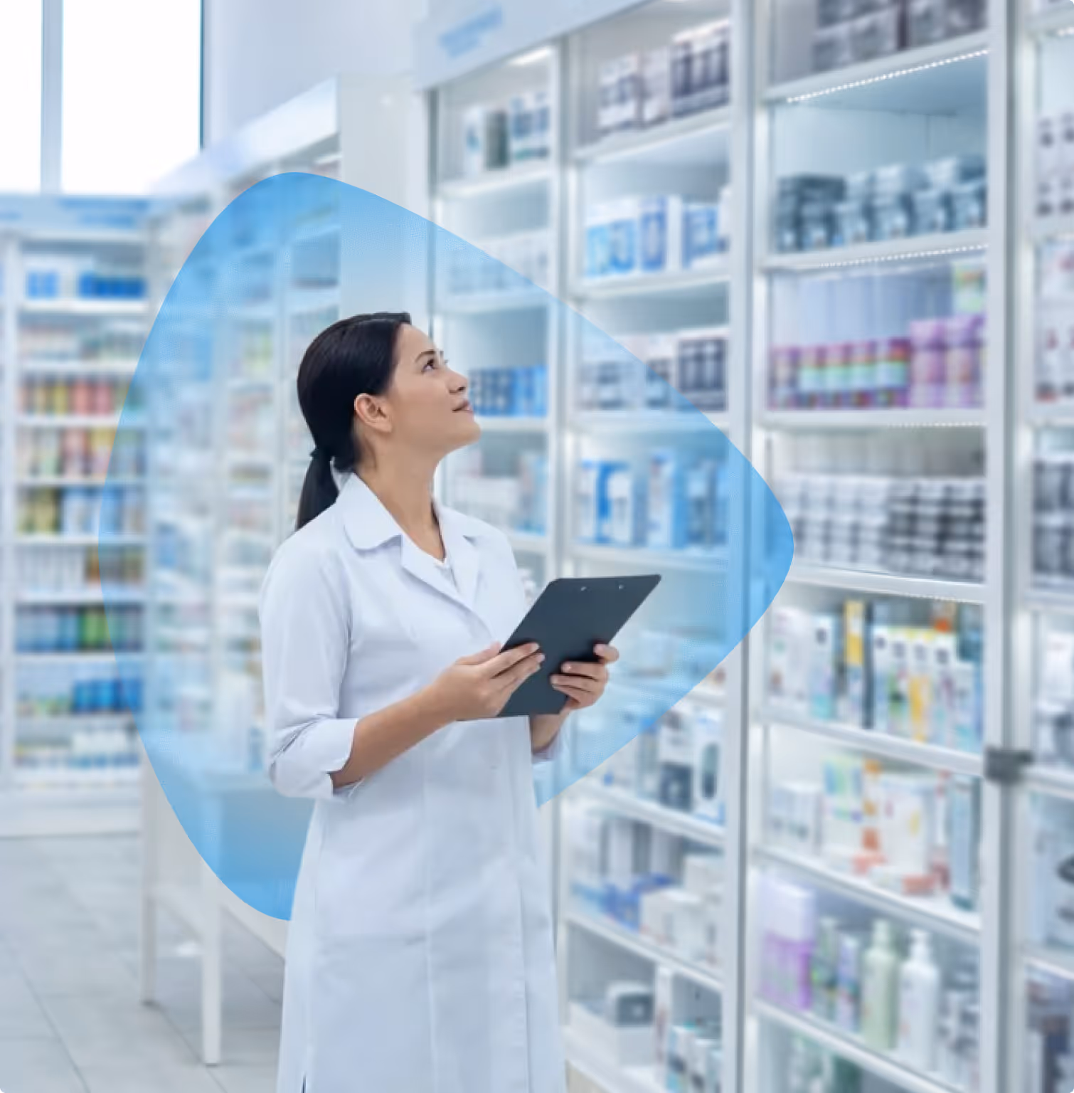 Pharmacist in a white coat holding a clipboard and checking shelves with medications in a pharmacy.