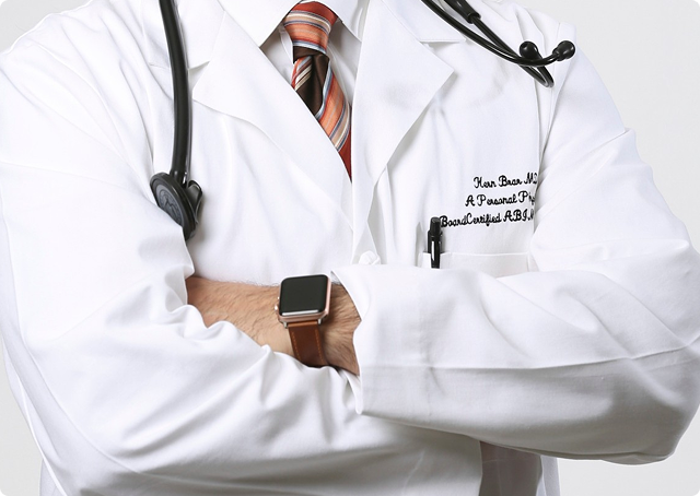 Close-up of a board-certified physician in a white lab coat with a stethoscope, representing expert medical care and professional clinical services.